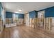 Bathroom with bright blue walls and double sink and doorway leading to other room at 103 W North Branch Rd, Ruskin, FL 33570