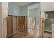 A view of the bathroom featuring the framed in construction and new flooring at 103 W North Branch Rd, Ruskin, FL 33570