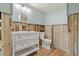 Renovated bathroom with white vanity, toilet and exposed framing at 103 W North Branch Rd, Ruskin, FL 33570