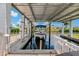 Covered boat dock equipped for secure boat storage and waterfront access at 103 W North Branch Rd, Ruskin, FL 33570