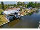 A well-maintained boat dock with a boat, offering easy access to waterfront activities at 103 W North Branch Rd, Ruskin, FL 33570