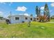 Charming single-story home with a well-manicured lawn and a white picket fence at 103 W North Branch Rd, Ruskin, FL 33570