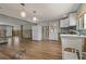 Bright kitchen features modern white cabinetry and stainless steel refrigerator at 103 W North Branch Rd, Ruskin, FL 33570