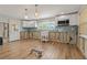 Bright kitchen features modern white cabinetry and stainless steel appliances at 103 W North Branch Rd, Ruskin, FL 33570