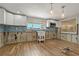 Bright kitchen features modern white cabinetry and stainless steel microwave at 103 W North Branch Rd, Ruskin, FL 33570
