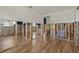 Open living room featuring new wood flooring and bright natural light at 103 W North Branch Rd, Ruskin, FL 33570