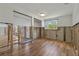 Partially renovated living room showing new flooring, window, and partial wall at 103 W North Branch Rd, Ruskin, FL 33570