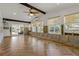 Spacious living room with wood floors, sliding glass door and lots of windows at 103 W North Branch Rd, Ruskin, FL 33570