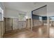 Partially renovated living room featuring blue accent walls and new flooring at 103 W North Branch Rd, Ruskin, FL 33570