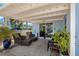 Covered patio features patio furniture and sliding glass doors to the interior at 103 W North Branch Rd, Ruskin, FL 33570