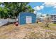 Exterior view of storage shed perfect for storing outdoor and recreational equipment at 103 W North Branch Rd, Ruskin, FL 33570