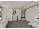 A utility room featuring a water heater, tile flooring, and a door to the exterior at 103 W North Branch Rd, Ruskin, FL 33570