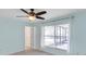 Bedroom with a window and ceiling fan at 10431 Frog Pond Dr, Riverview, FL 33569