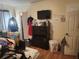Bedroom with a chest of drawers and wall-mounted TV at 10539 Parkcrest Dr, Tampa, FL 33624