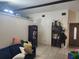 Cozy living room with neutral-toned walls, tiled flooring, and comfortable seating at 10539 Parkcrest Dr, Tampa, FL 33624