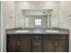 Bathroom features granite countertop, and sinks, dark cabinetry, and ample counter space at 10822 Crushed Grape Dr, Riverview, FL 33578