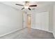 Inviting bedroom with carpet flooring, a ceiling fan, and closet at 10822 Crushed Grape Dr, Riverview, FL 33578
