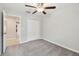 Comfortable bedroom with a ceiling fan, carpet, and a closet for ample storage at 10822 Crushed Grape Dr, Riverview, FL 33578