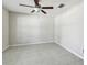 Cozy bedroom featuring tiled floors and a classic ceiling fan for added comfort at 10822 Crushed Grape Dr, Riverview, FL 33578