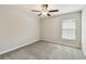 Bedroom with ceiling fan and a window providing natural light at 10822 Crushed Grape Dr, Riverview, FL 33578