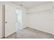Walk-in closet with carpeted floor and ample shelving for storage at 10822 Crushed Grape Dr, Riverview, FL 33578