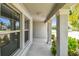 Covered front porch with a view to the front door at 10822 Crushed Grape Dr, Riverview, FL 33578