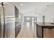 Open-concept kitchen with granite countertops and stainless steel appliances at 10822 Crushed Grape Dr, Riverview, FL 33578