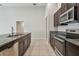 Well-equipped kitchen featuring granite countertops and stainless steel appliances at 10822 Crushed Grape Dr, Riverview, FL 33578