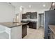 Modern kitchen featuring granite countertops, stainless steel appliances, and ample cabinet space at 10822 Crushed Grape Dr, Riverview, FL 33578