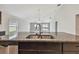 Kitchen island featuring a sink and granite countertop at 10822 Crushed Grape Dr, Riverview, FL 33578