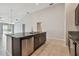 Open-concept kitchen with granite island, stainless steel dishwasher, and easy access to living area at 10822 Crushed Grape Dr, Riverview, FL 33578