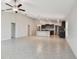 Open-concept living room and kitchen area with ample space at 10822 Crushed Grape Dr, Riverview, FL 33578