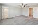 The bedroom has carpeting and access to an ensuite bathroom and walk-in closet at 10822 Crushed Grape Dr, Riverview, FL 33578