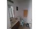 Bathroom features a single sink vanity and a dinosaur-themed shower curtain at 10850 Lake Saint Charles Blvd, Riverview, FL 33578