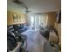 Comfortable living room with a large sectional sofa, tile flooring, and plenty of natural light at 10850 Lake Saint Charles Blvd, Riverview, FL 33578