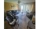 Comfortable living room with a large sectional sofa, tile flooring, and plenty of natural light at 10850 Lake Saint Charles Blvd, Riverview, FL 33578