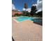 Community pool surrounded by brick pavers at 10850 Lake Saint Charles Blvd, Riverview, FL 33578