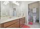 Bathroom with a wooden cabinet and double wide mirror above the counter at 1116 Hillandale Reserve Dr, Tampa, FL 33613
