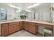 Expansive bathroom featuring an abundance of counter space with double sinks, lots of lighting, and vanity seating at 1116 Hillandale Reserve Dr, Tampa, FL 33613