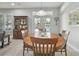 Bright dining room featuring wood table, hutch, view to backyard and pool at 1116 Hillandale Reserve Dr, Tampa, FL 33613