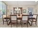 Elegant dining room featuring a large table, a chandelier, and tile floors at 1116 Hillandale Reserve Dr, Tampa, FL 33613