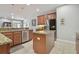 This kitchen is enhanced with granite countertops, tiled floor, and stainless steel appliances at 1116 Hillandale Reserve Dr, Tampa, FL 33613