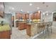 Kitchen with stone counters, stainless steel appliances, and island seating at 1116 Hillandale Reserve Dr, Tampa, FL 33613