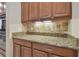 Close-up of kitchen counter featuring cabinets and backsplash at 1116 Hillandale Reserve Dr, Tampa, FL 33613