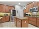 Well-equipped kitchen boasts stainless steel appliances, granite countertops, and ample cabinet space at 1116 Hillandale Reserve Dr, Tampa, FL 33613