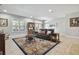 Spacious living room features natural light, cozy seating, and tile flooring at 1116 Hillandale Reserve Dr, Tampa, FL 33613