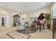 Comfortable living room featuring tile floors, comfortable seating, and a piano at 1116 Hillandale Reserve Dr, Tampa, FL 33613