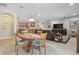 Open-concept with dining area, kitchen, living room with a TV and tile floors at 1116 Hillandale Reserve Dr, Tampa, FL 33613