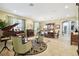 Open-concept living room featuring tile floors, a piano, and an elegant seating arrangement at 1116 Hillandale Reserve Dr, Tampa, FL 33613