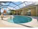 Screened-in pool with attached spa, lounge chair, and covered outdoor seating at 1116 Hillandale Reserve Dr, Tampa, FL 33613